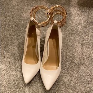 White stilettos with snake ankle wrap detail